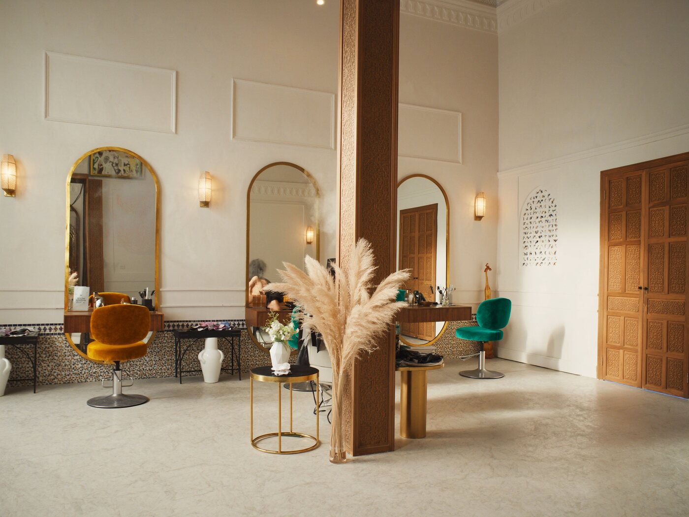 Salon with horseshoe-arch brass mirrors
