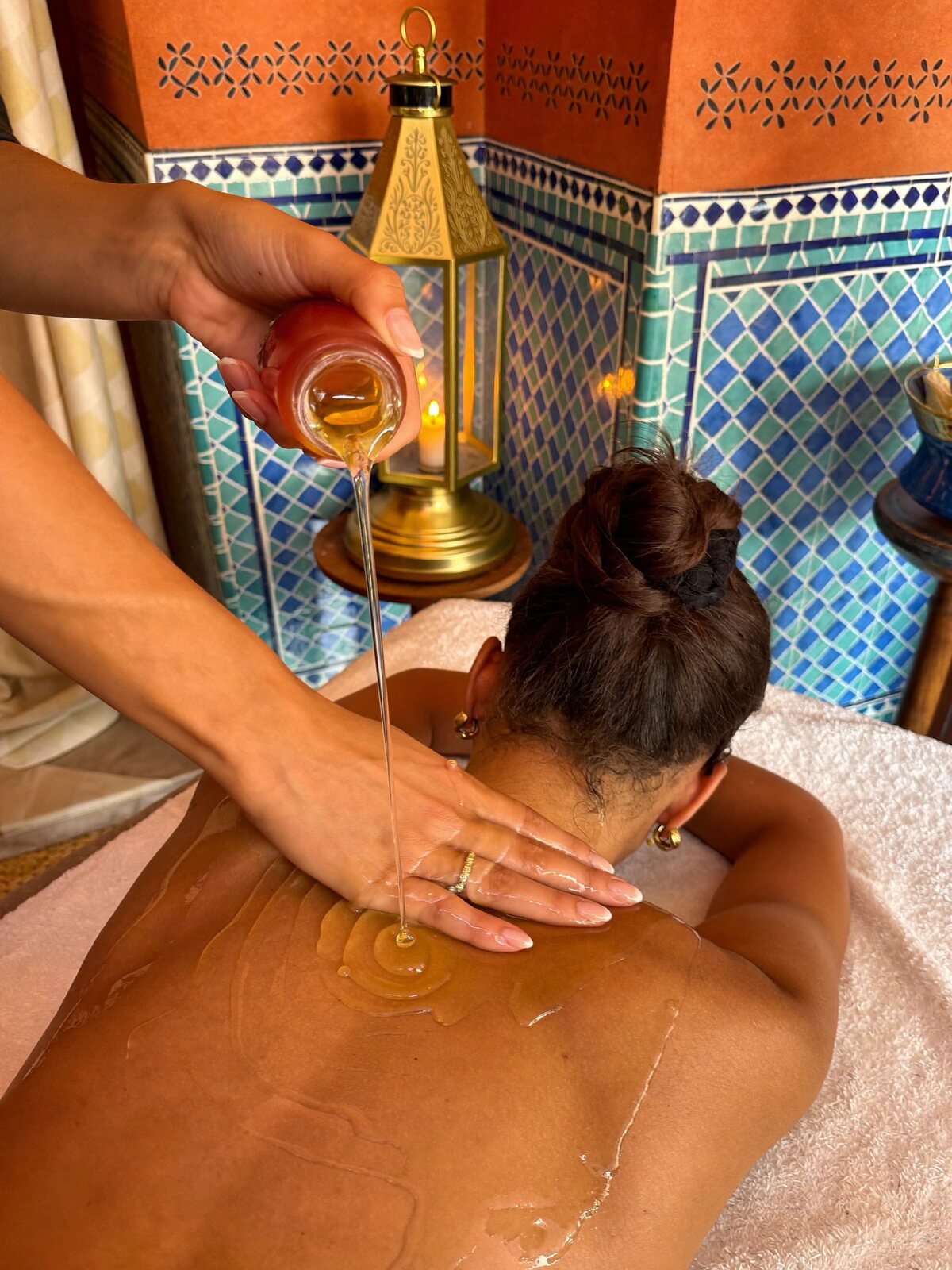 Argan oil massage by lantern light